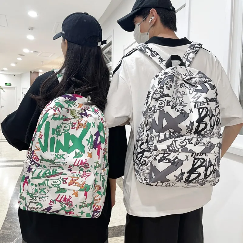 涂鸦新款双肩包男大容量初中高中大学生书包女韩版潮酷背包