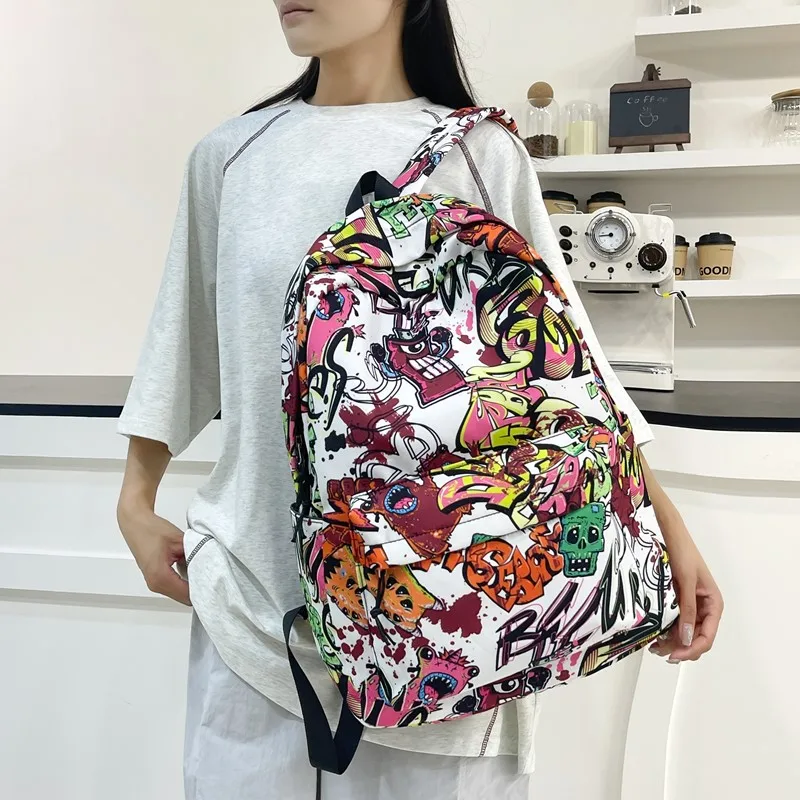 涂鸦潮酷跨境新款双肩包男大容量初高中大学生书包女跨境背包